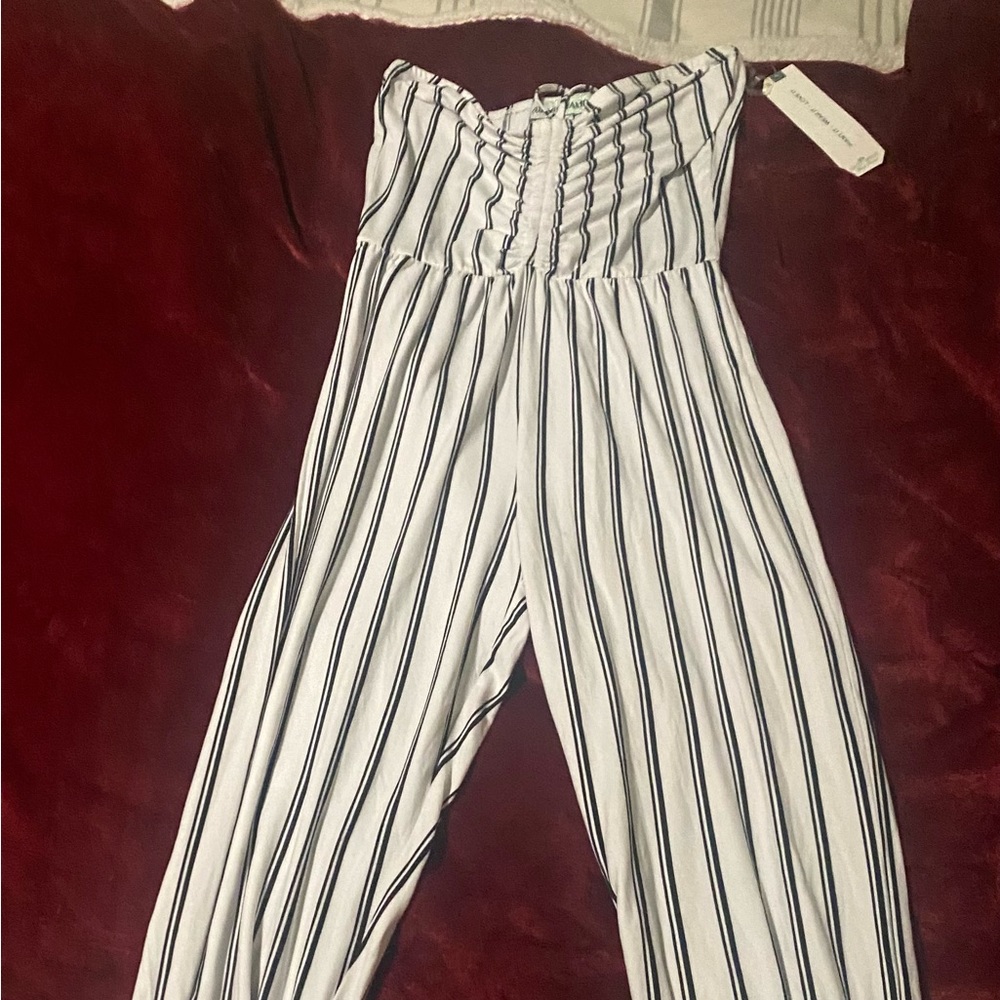 Women’s size small, white and black striped jumpsuit with new tags